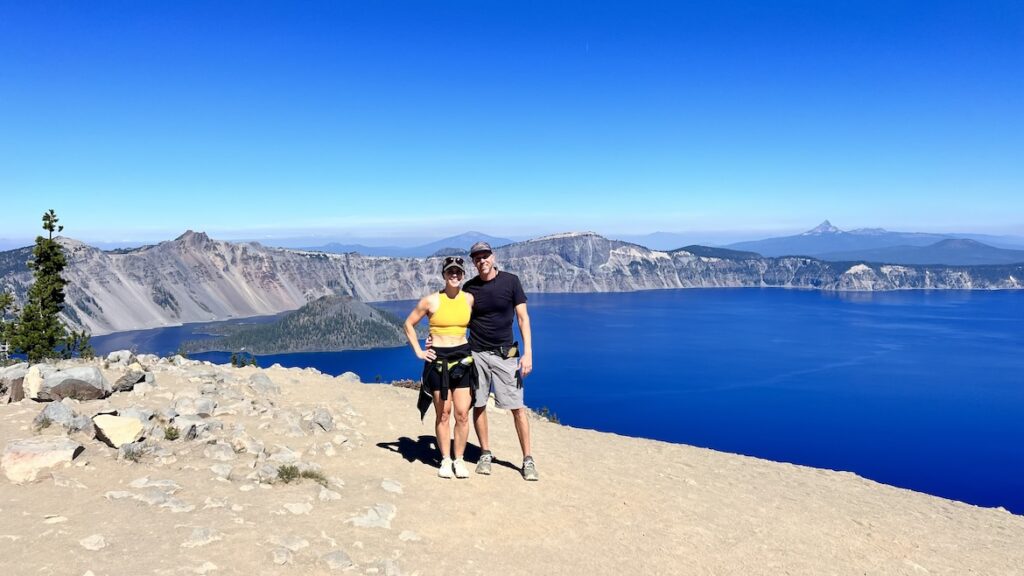 Healthy and fit couple standing at Crater Lake